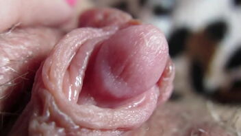 Close up of a wondrous and moist twat with a clean-shaved and rosy pussy.